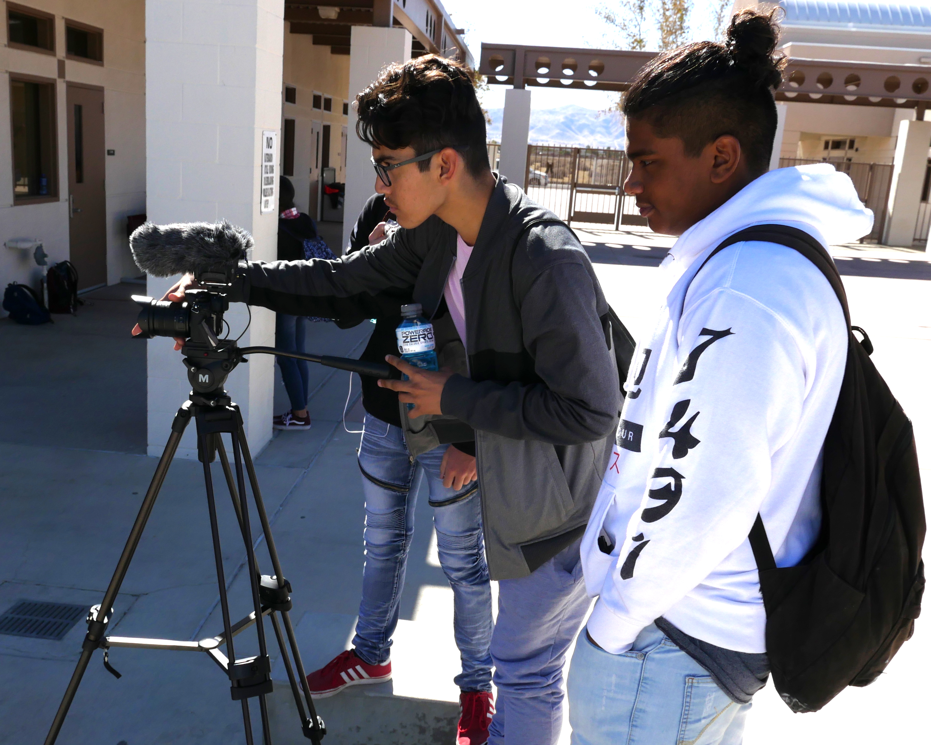 photo of GHHS students working a camera