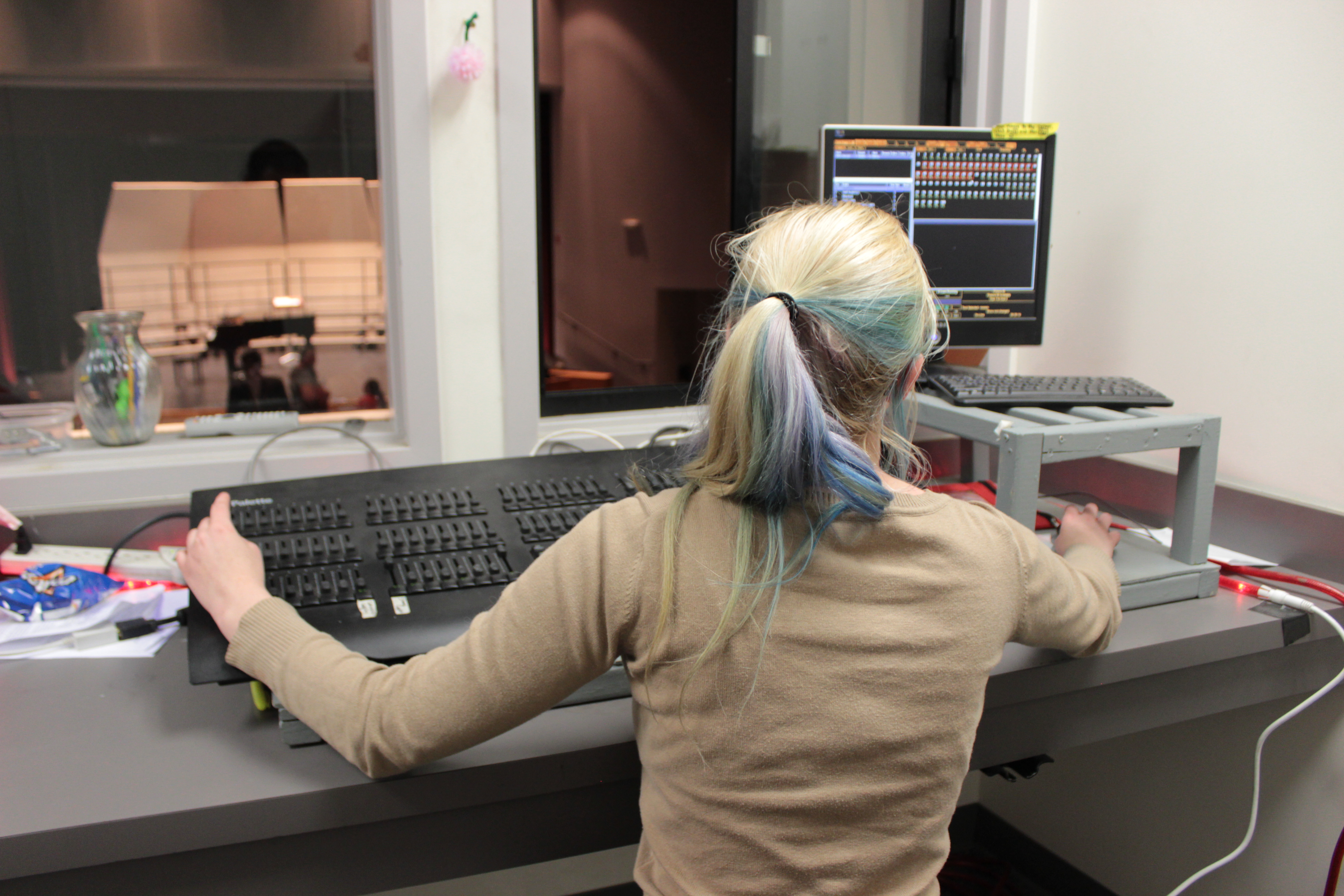 Girl working light board